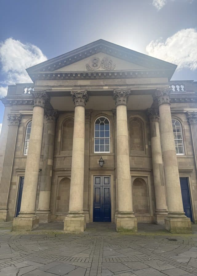 The sandstone facade and portico of St George's on High Street