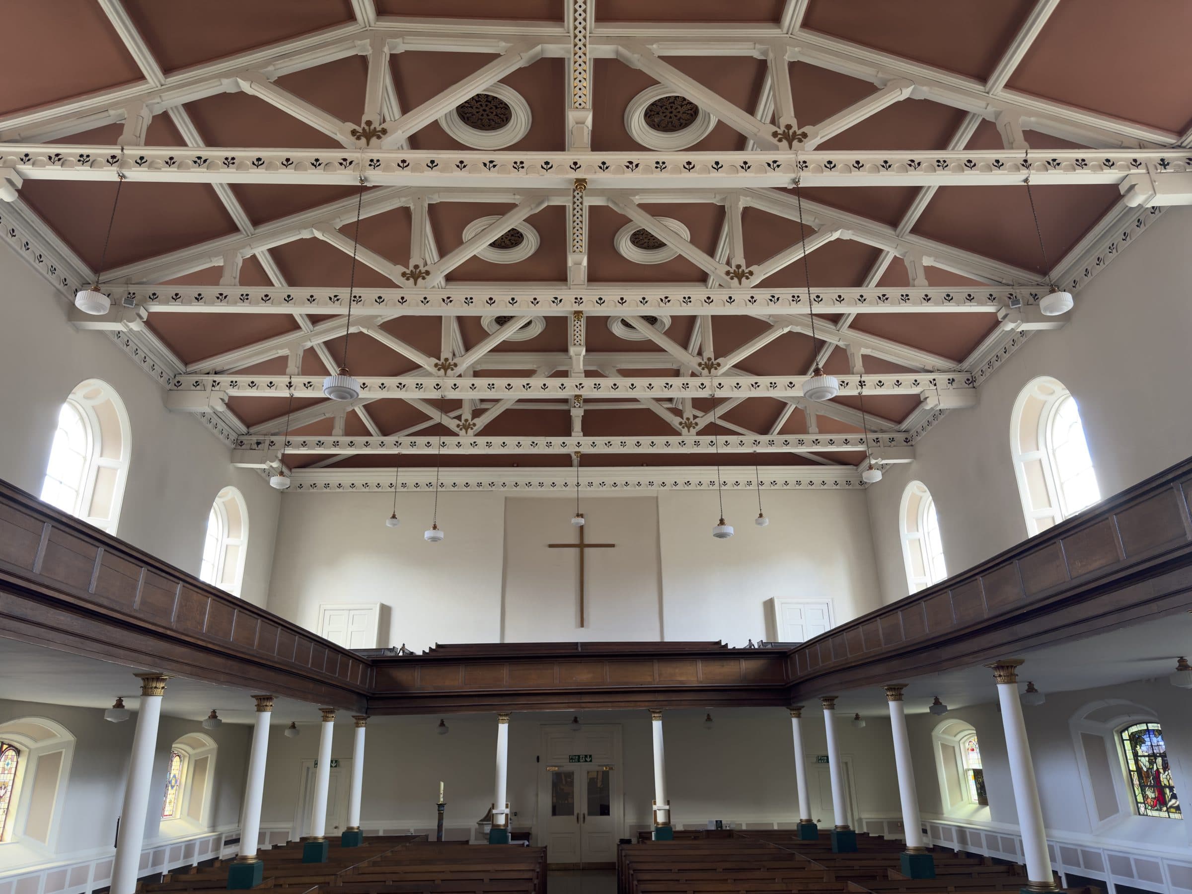 The nave and galleries of St George's in daylight, seen from the chancel