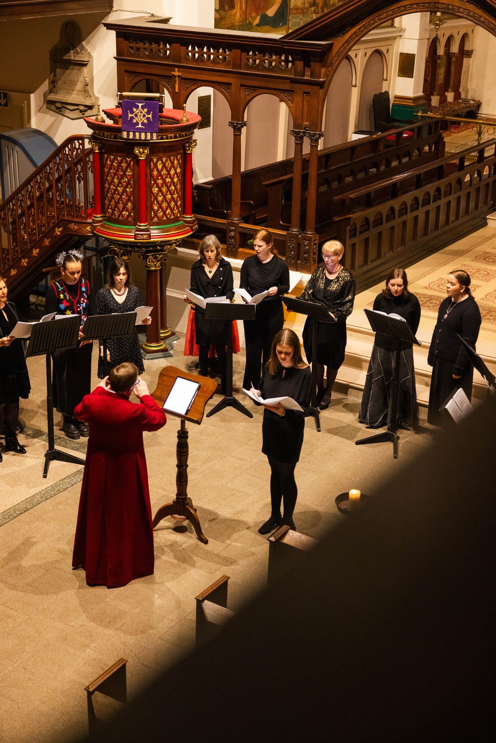 The Chamber Choir performing in St George's with their conductor