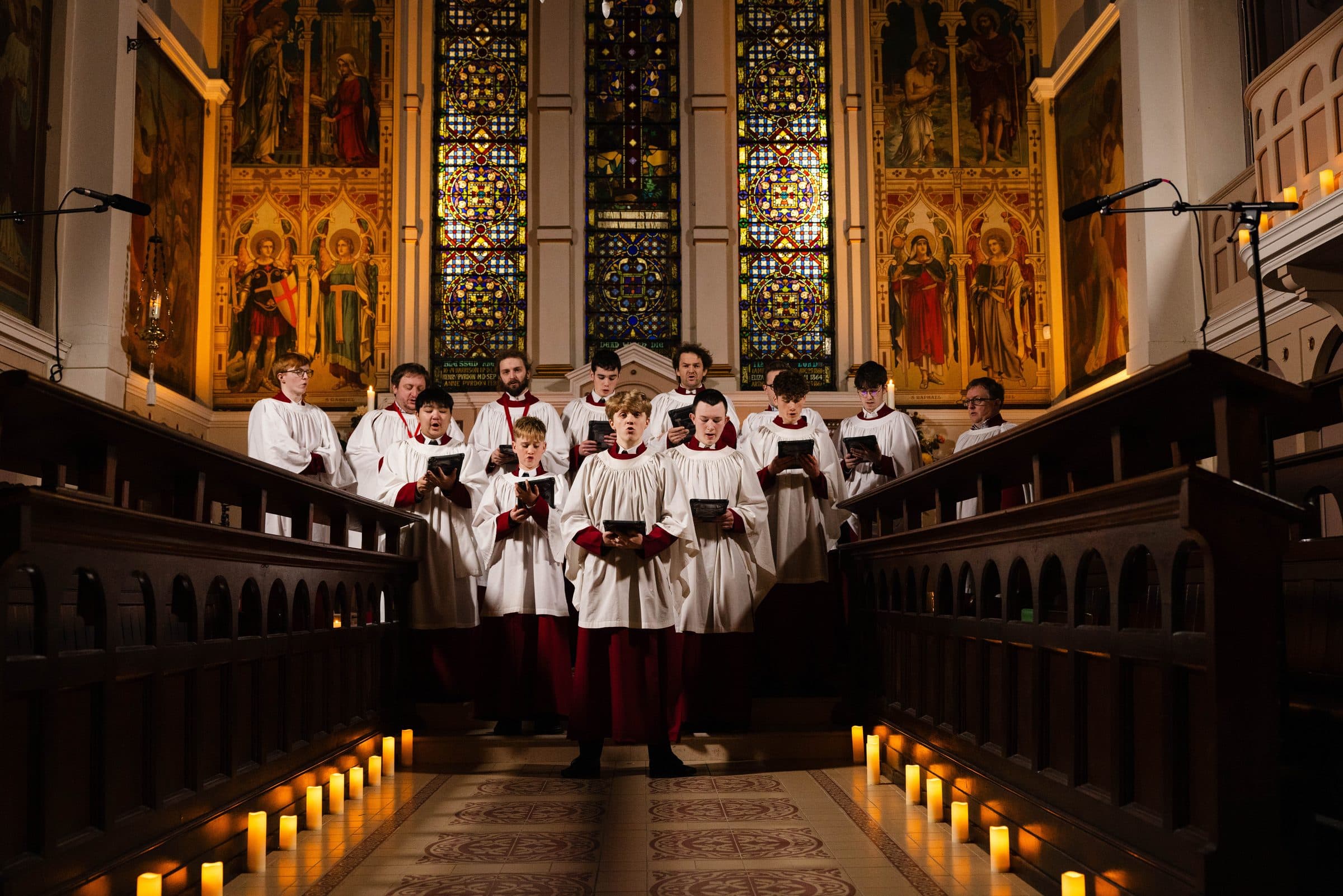 The Parish Choir singing in the candlelit choir stalls at St George’s