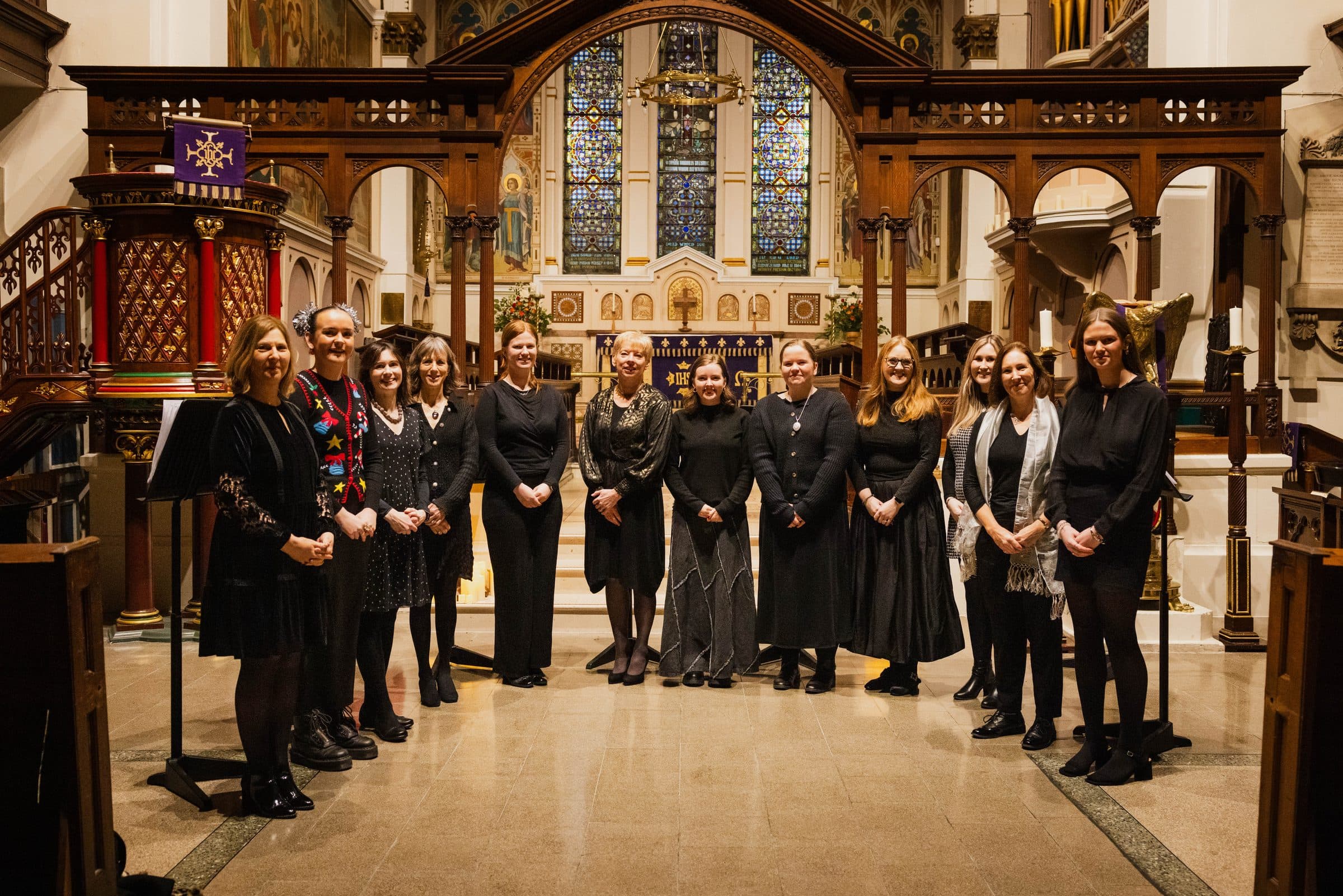 The SSA Choir of St George's gathered before the chancel screen